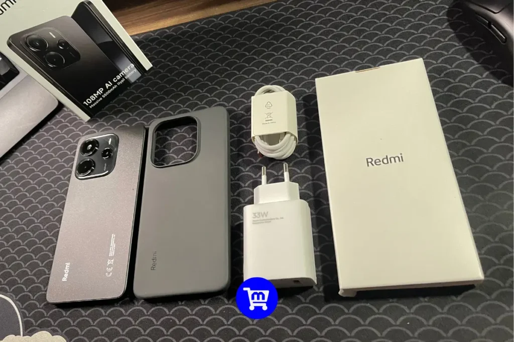 Vale a Pena Comprar o Redmi Note 14 4G? Análise Completa 2 Conteúdo completo da caixa do Redmi Note 14 4G incluindo smartphone, carregador, cabo, capinha e caixa.