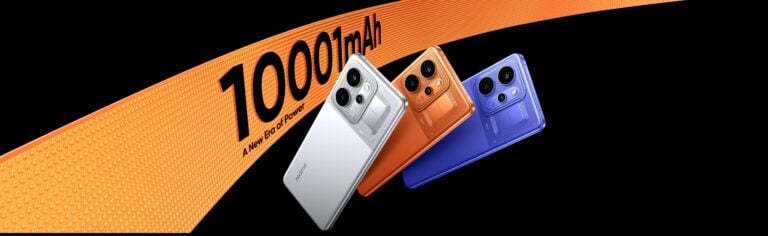 Três celulares da realme ao lado de letreiro com destaque para bateria de 10.001 mAh